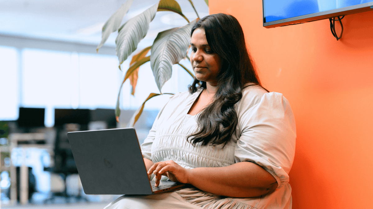 Dijital Team member working on a laptop in the office
